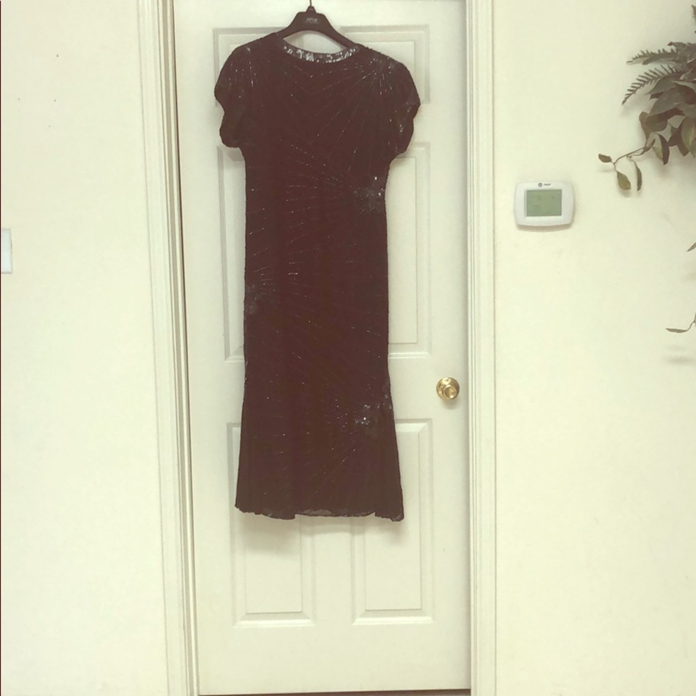 A long black, sequined dress. Perfect for a Gala.